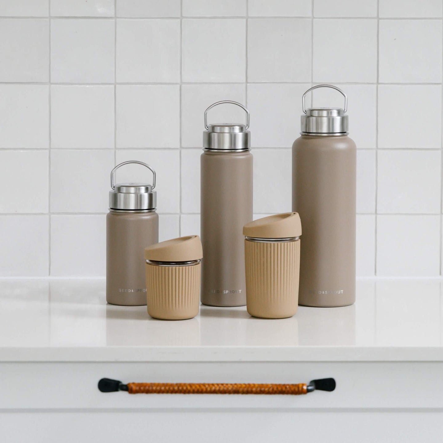 the beige coffee and water containers