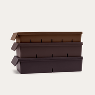 Freezer Tray Starter Set in Macadamia Brown, showing all three lidded silicone trays stacked — 6, 4, and 2 portion sizes