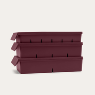 Freezer Tray Starter Set in Mulberry Red, showing all three lidded silicone trays stacked — 6, 4, and 2 portion sizes